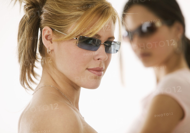 Portrait of women wearing sunglasses.