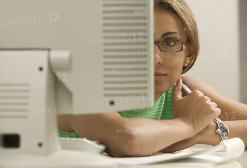 Woman looking at computer monitor.