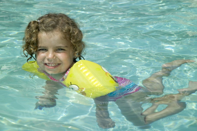 Little girl swimming.
