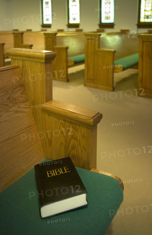 Church interior with Bible on a pew.