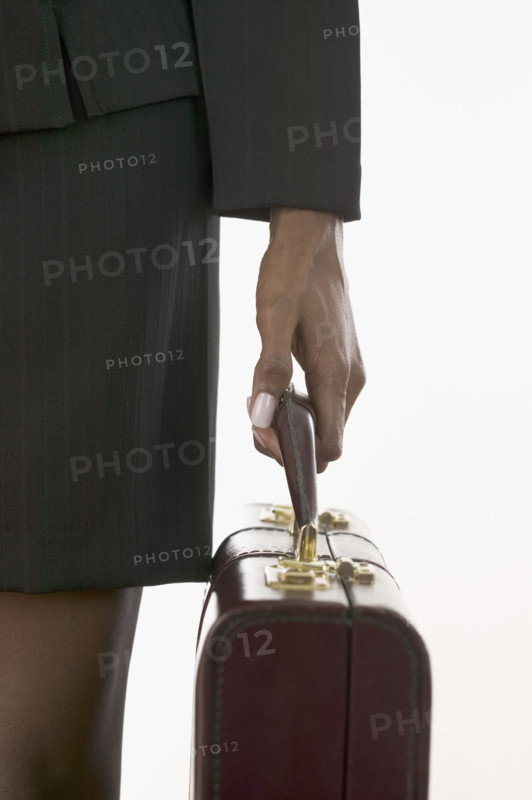 Closeup of woman holding a briefcase.