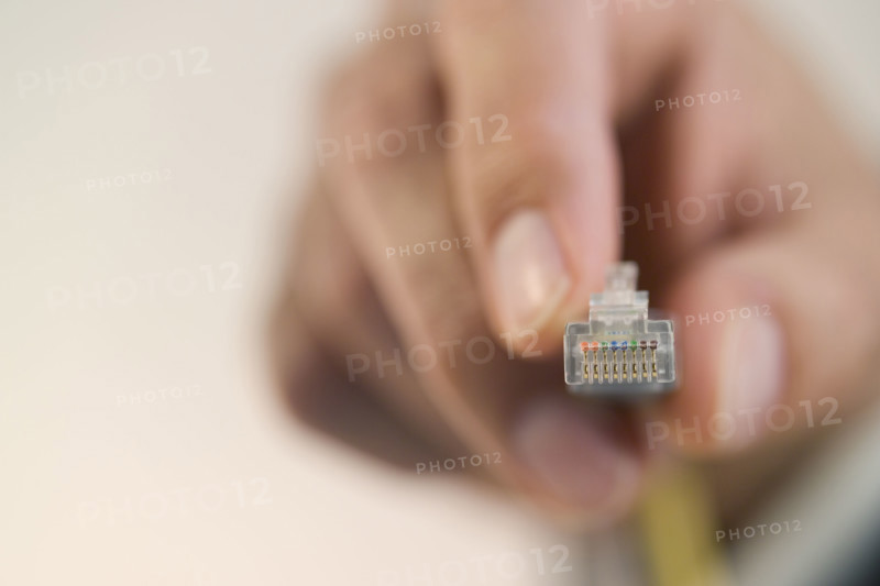 Person connecting a cable.