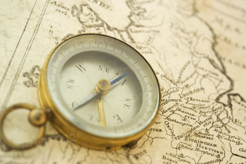Closeup of a map and compass.