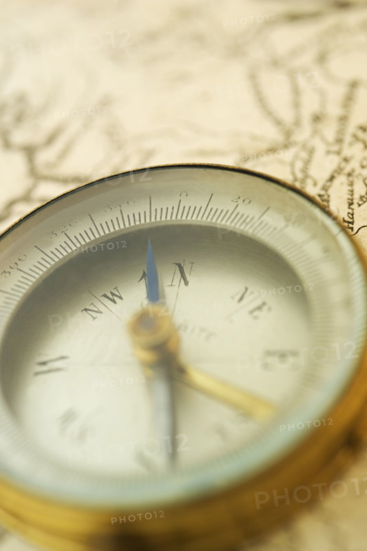 Closeup of a map and compass.