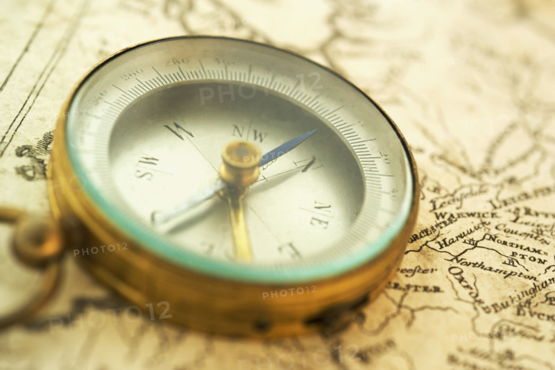 Closeup of a map and compass.