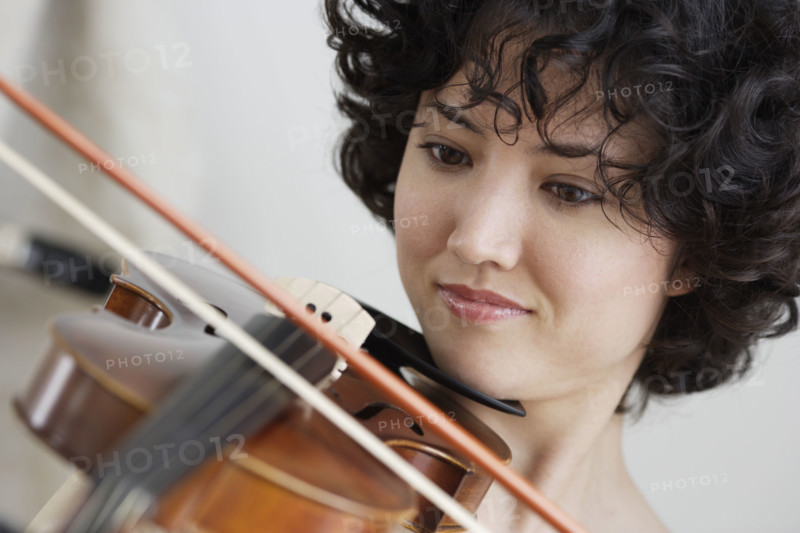 Woman playing the violin.