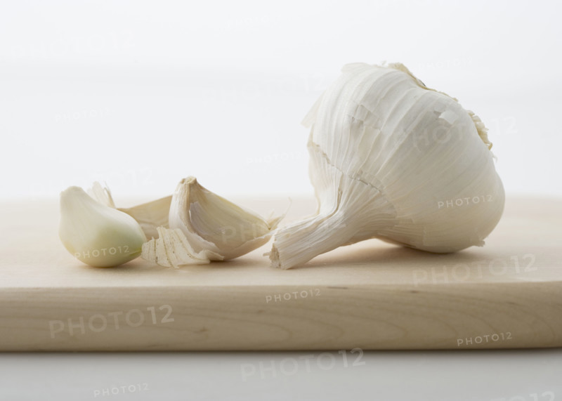 Garlic on cutting board.
