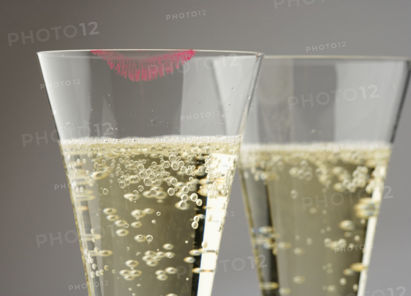 Closeup of champagne with lipstick print.