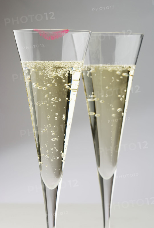 Champagne glasses with lipstick print.