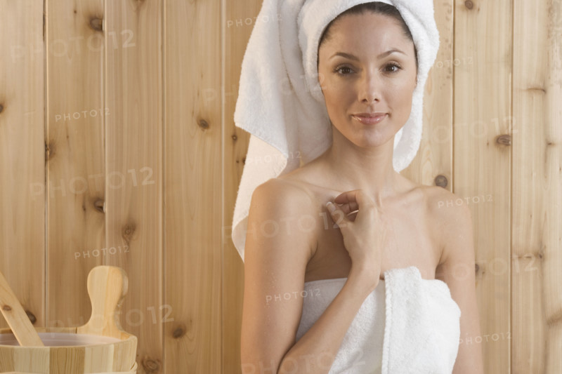 Smiling woman in sauna.