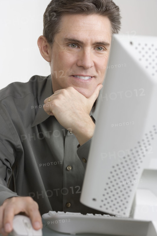 Businessman working at computer.