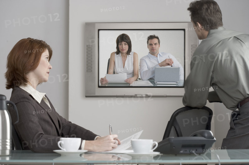 Businesspeople in videoconference.