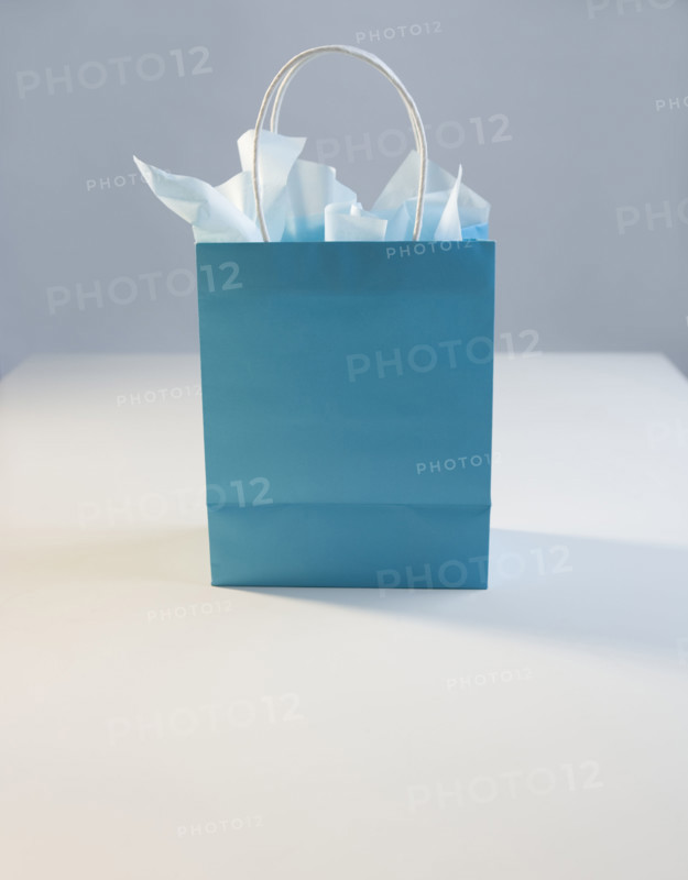 Blue gift bag with tissue paper.