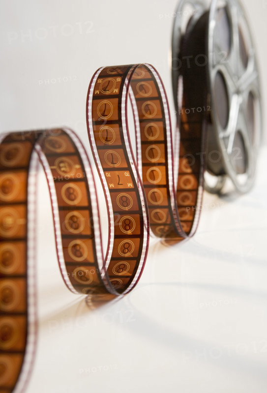 Movie film reel unrolling.