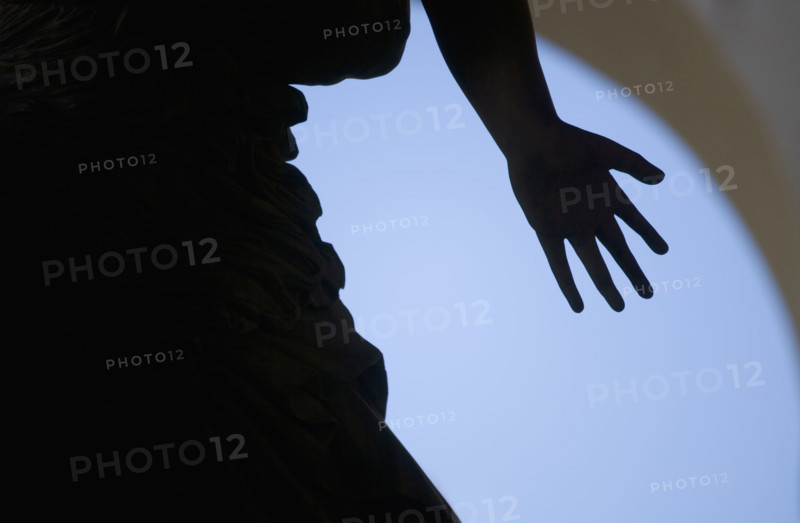 Silhouette of hand on statue Florence Italy.