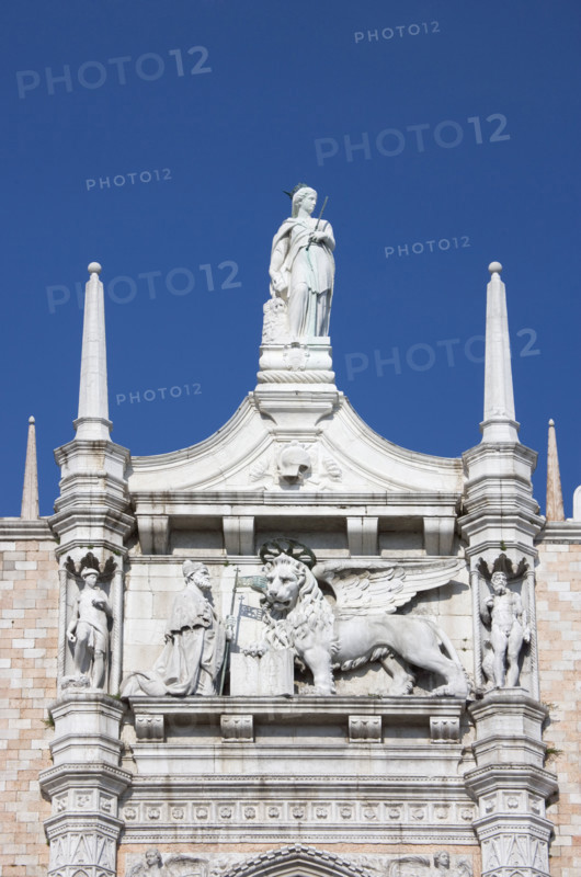 Doges' Palace with Statue of the Doge before the Symbol of Venice Italy.
