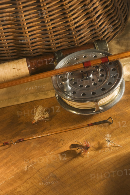 Still life of antique fishing reels.