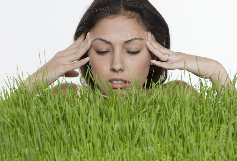 Stressed woman with long grass.