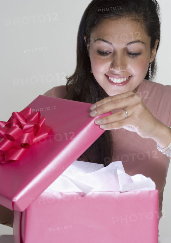 Woman opening present.