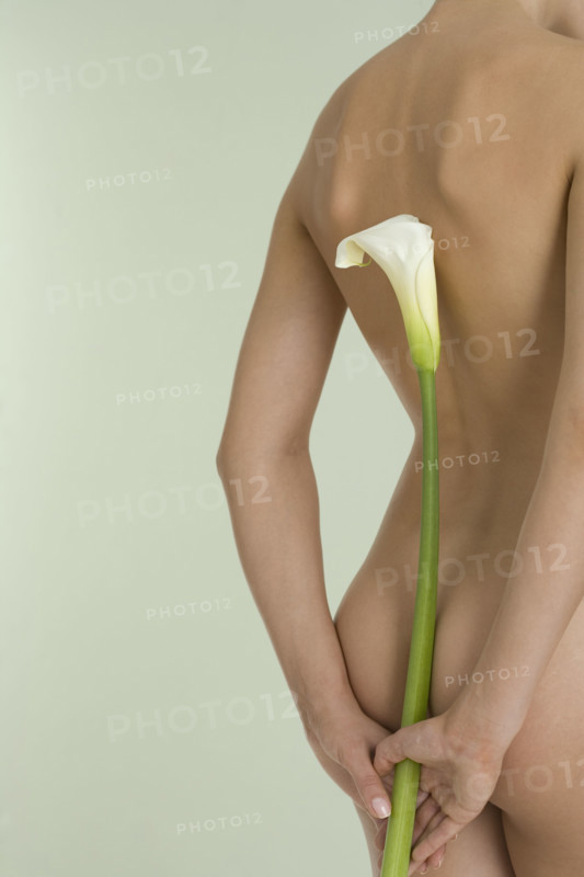 Nude female with calla lily.