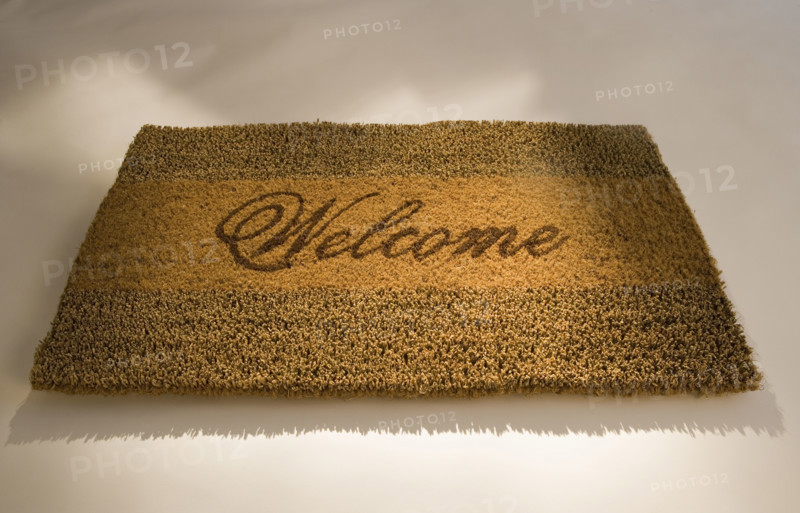 Closeup of a welcome mat.