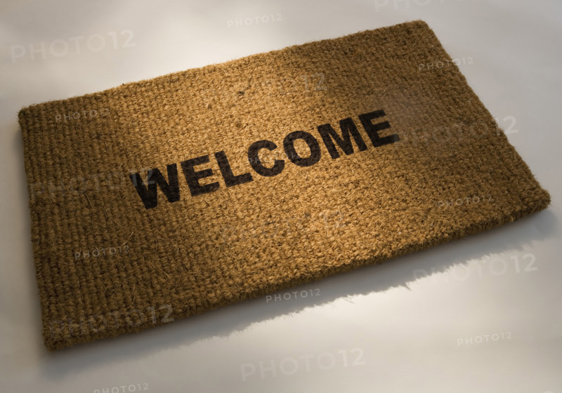 Closeup of a welcome mat.