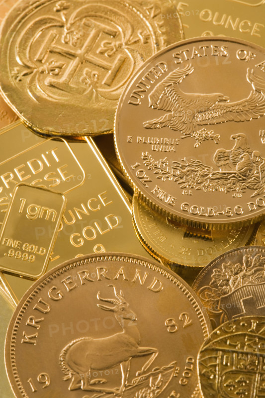 Still life of gold bars and coins.