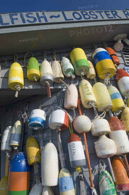 Buoys hanging on building.