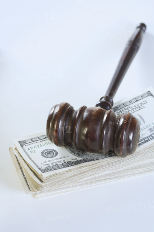 Still life of gavel and money.
