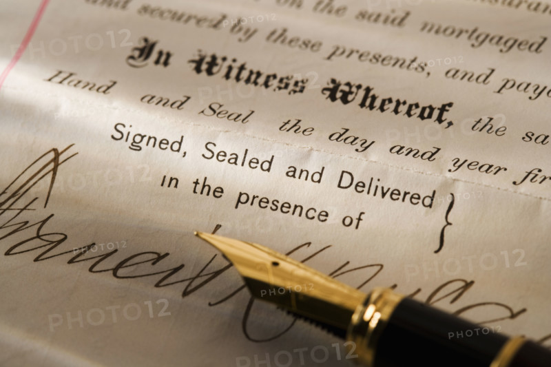 Closeup of pen and contract.
