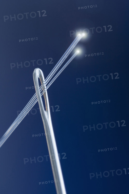 Needle with fiber optic threads.