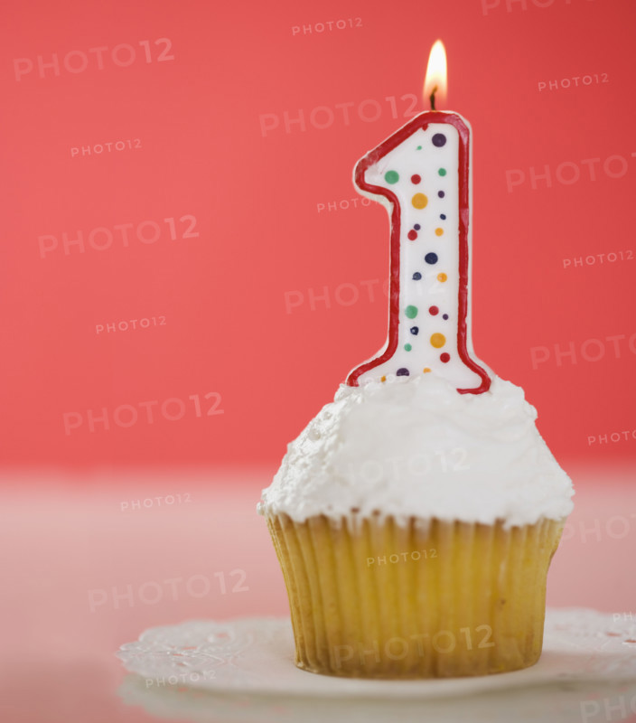 One candle on a cupcake.