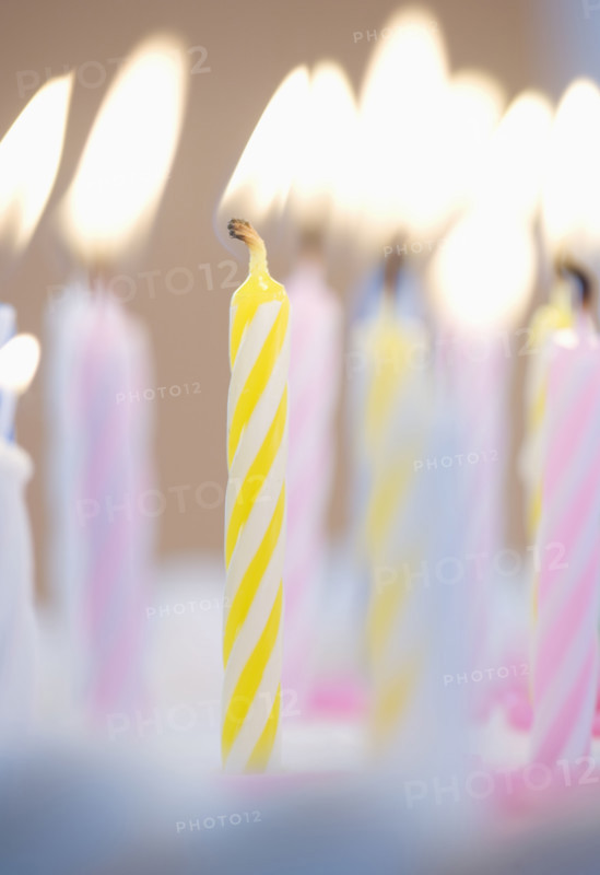 Lit candles on a cake.