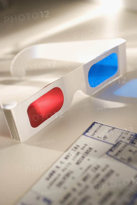 Still life of 3-D glasses and movies tickets.