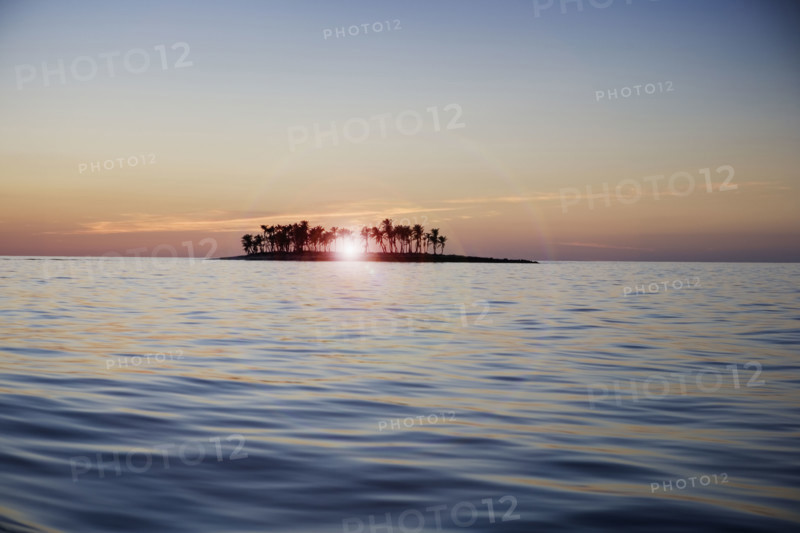 Sunset over tropical island.