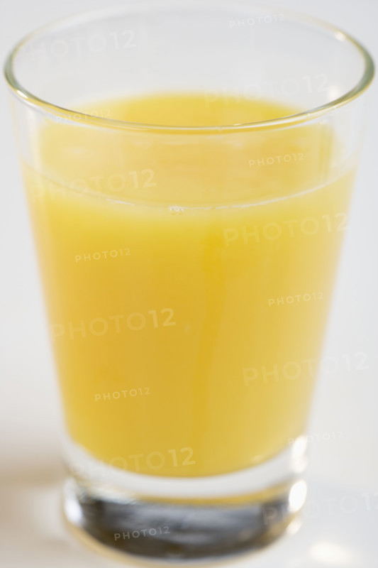 Closeup of glass of orange juice.