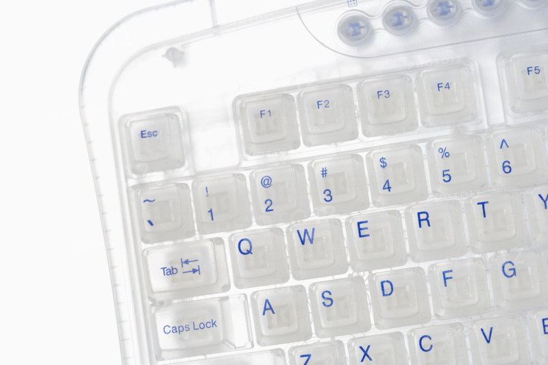 Closeup of corner of transparent keyboard.