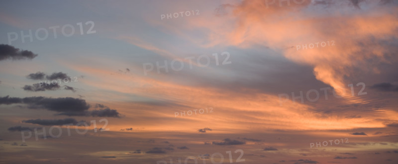 Sunlight from behind clouds.