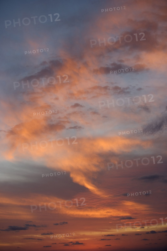 Sunlight from behind clouds.