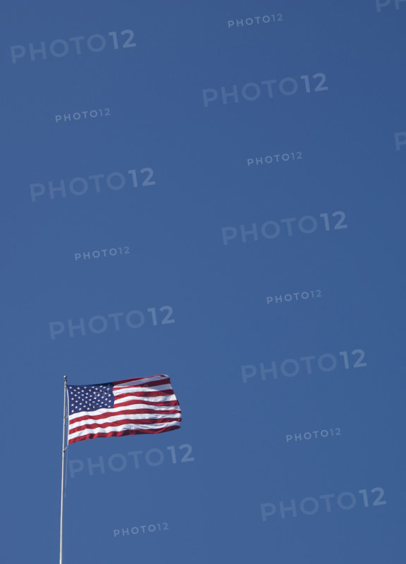 American flag against blue sky.