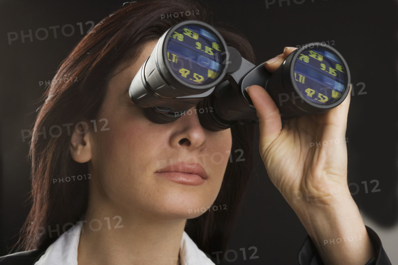 Woman looking through binoculars.