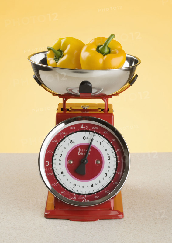Still life of scale and peppers.