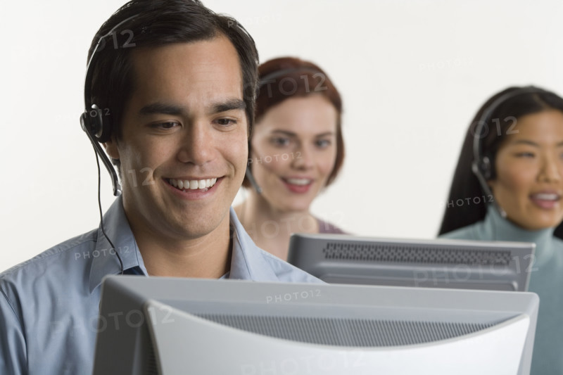 Phone operators using headsets.