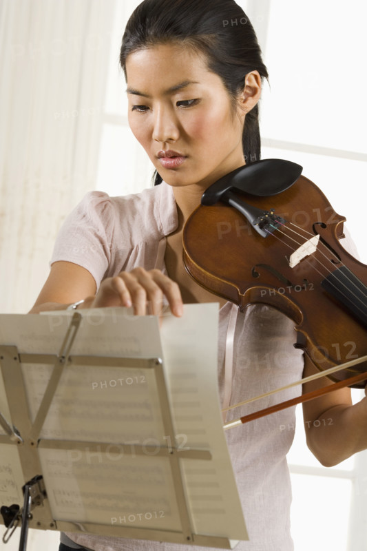 Woman playing the violin.