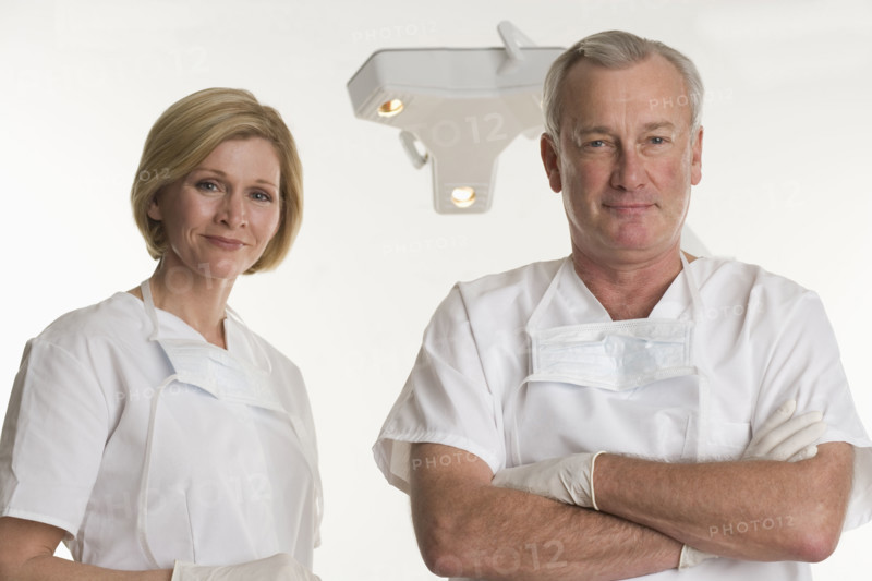 Portrait of dentist with dental hygienist.