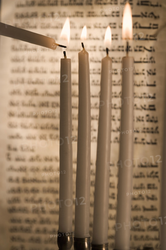 Lighting a menorah.