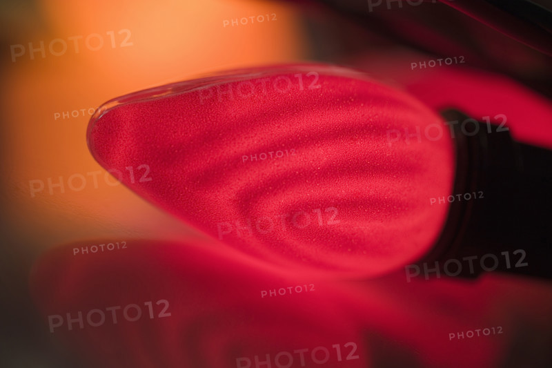 Closeup of a glowing Christmas light bulb.