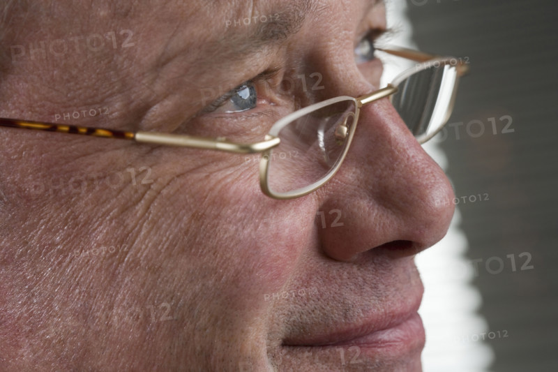 Portrait of man with glasses.