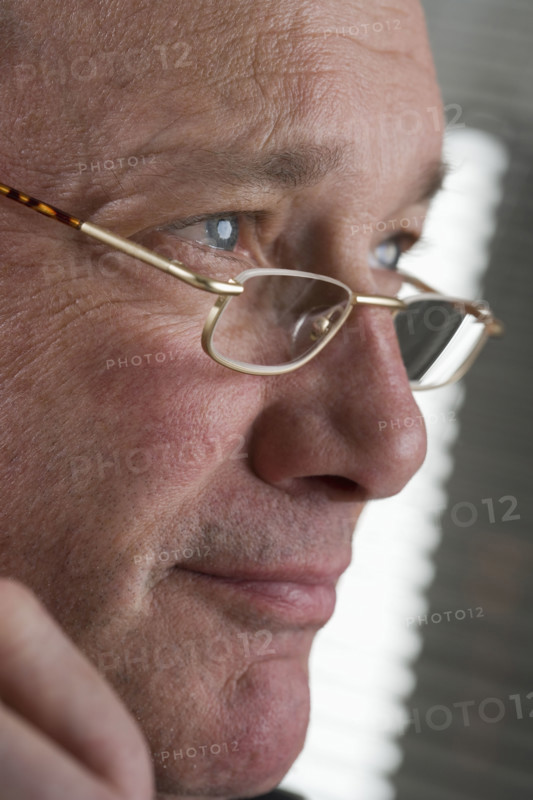 Portrait of man with glasses.
