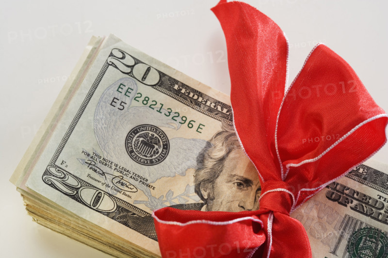 A stack of money with a bow.